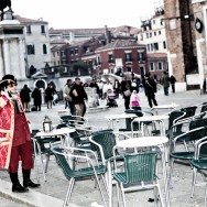 Venice-gentleman dressed in 18th century costume on the cellphone in Venice, color landscape photo
