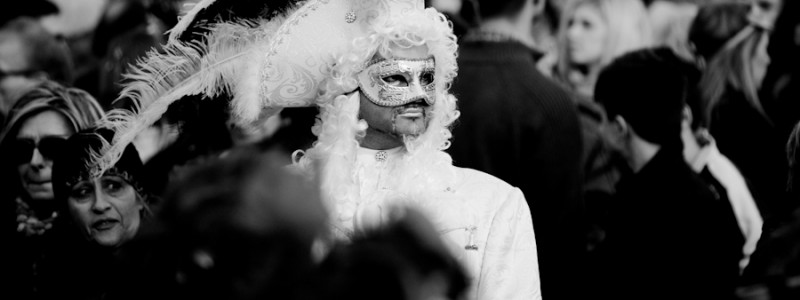 Venice - Man in white carnival costume in St. Mark's Square, black & white landscape photo