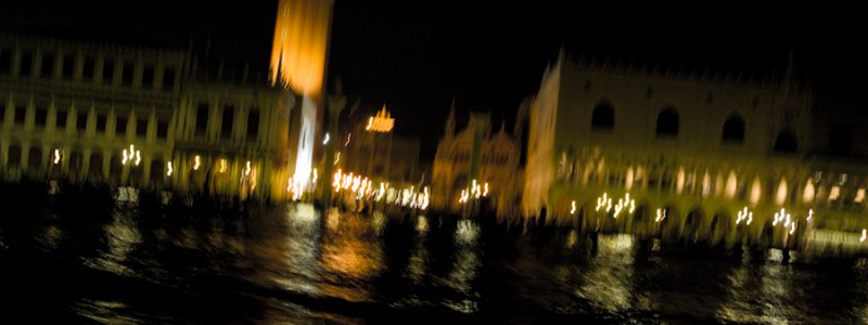 Venice - St. Mark's Basin at night viewed from motor boat, color landscape photo