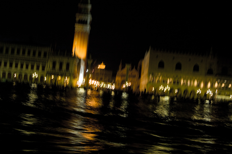 Venice - St. Mark's Basin at night viewed from motor boat, color landscape photo