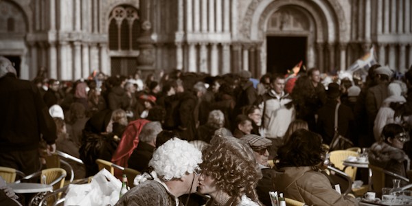 Venice-couple in carnival costume kissing in St. Mark's square, color portrait photo
