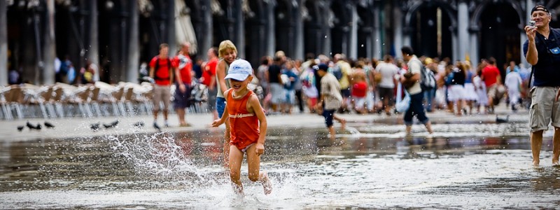 Venice - kids playing with high-water in St. Mark's Square, color landscape photo