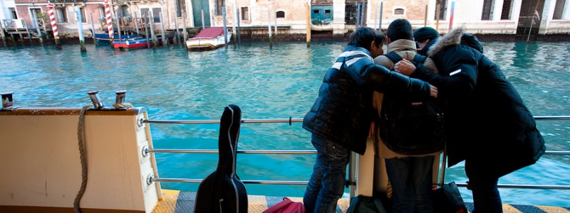 Venice-three boys on a waterbus in Grand Canal