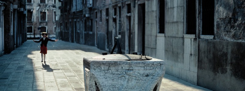 Venice - little girl playing with rope in an alley, color landscape photo