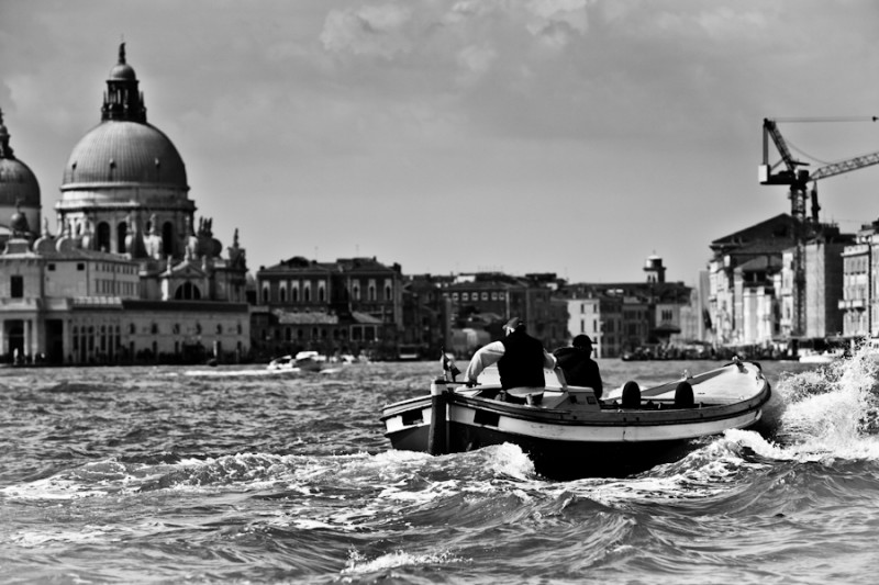 Venice - motorboat with church of Salute in the background, black and white photo