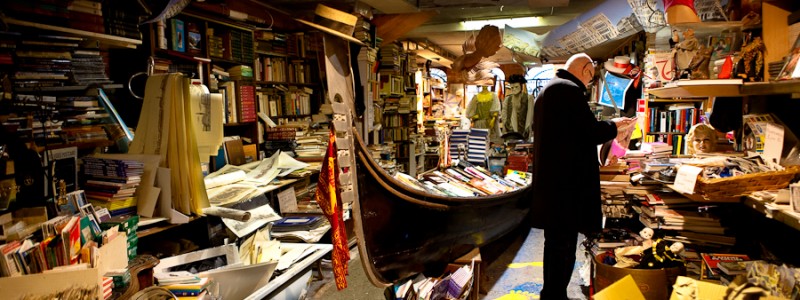 Venice - gondola used as bookshelf inside a bookstore, color landscape photo